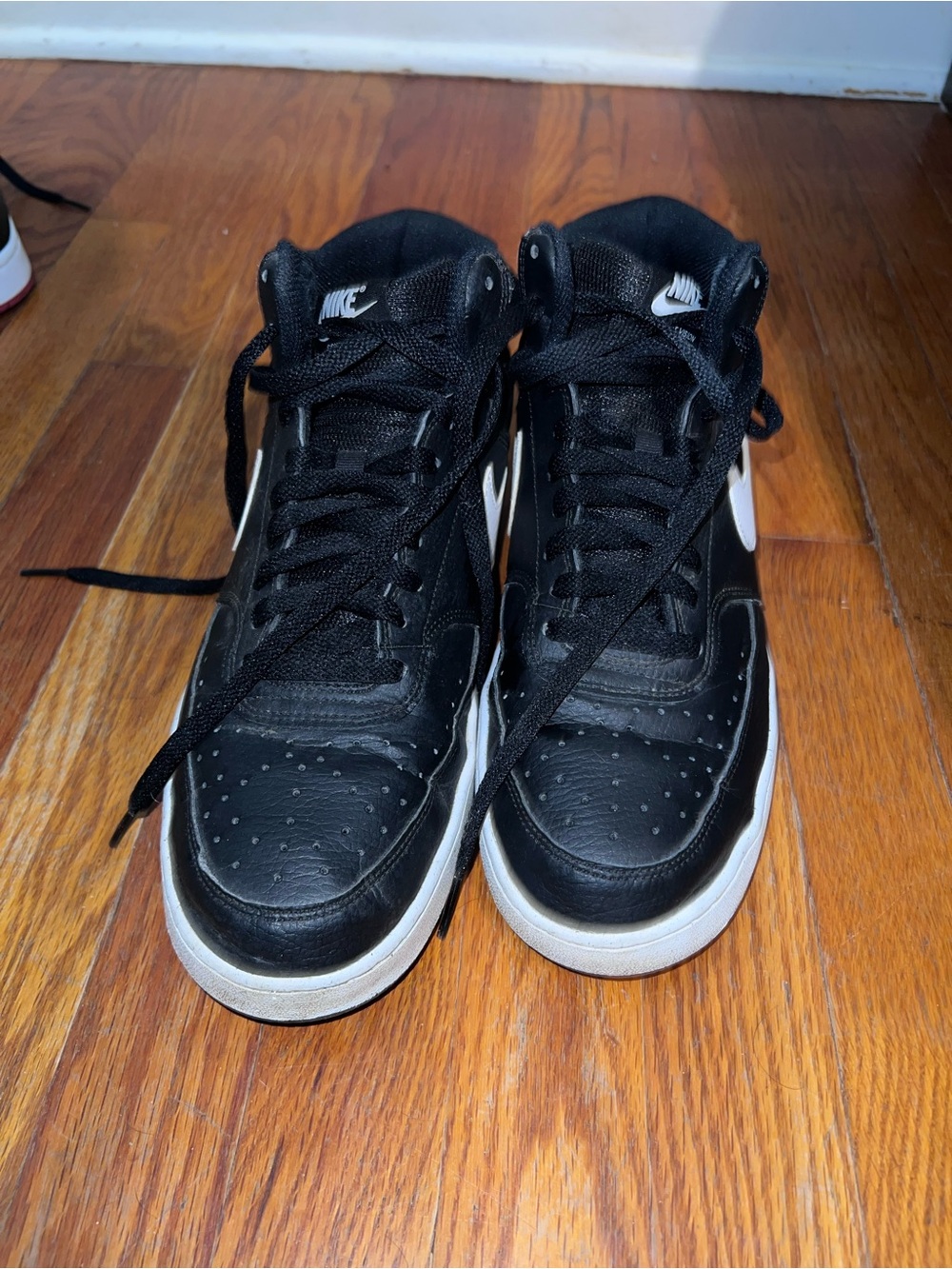 Nike Black and White Mid-Top Sneakers with Swoosh